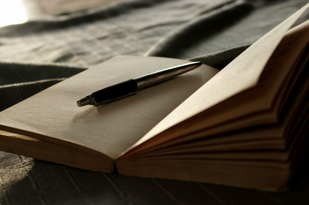 writer revising manuscript